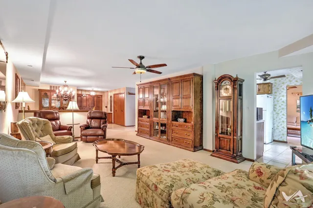 a kitchen with stainless steel appliances granite countertop a sink and a refrigerator