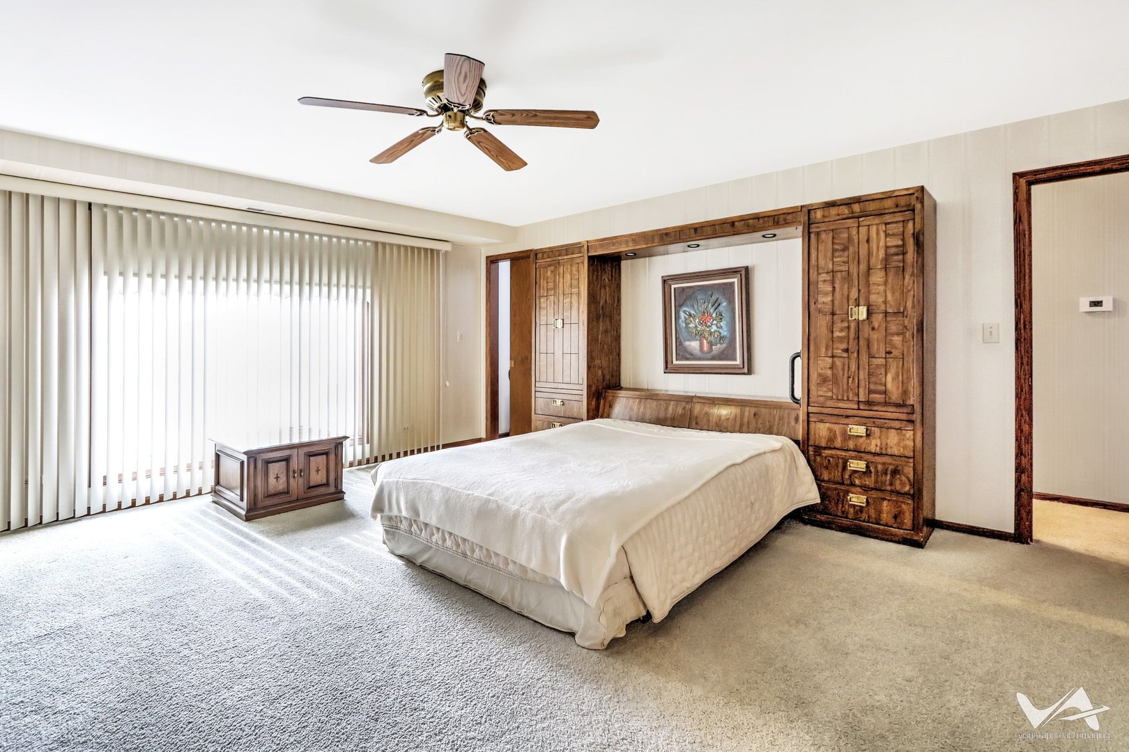 467 Hiawatha Trail, Unit 201 Wood Dale, IL 60191 - Photo 18 of 35 a bedroom with a bed and a chandelier