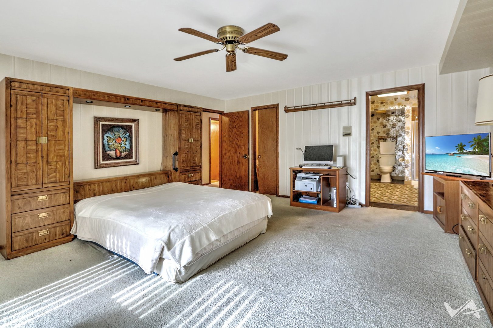 467 Hiawatha Trail, Unit 201 Wood Dale, IL 60191 - Photo 19 of 35 a spacious bedroom with a bed and a chandelier
