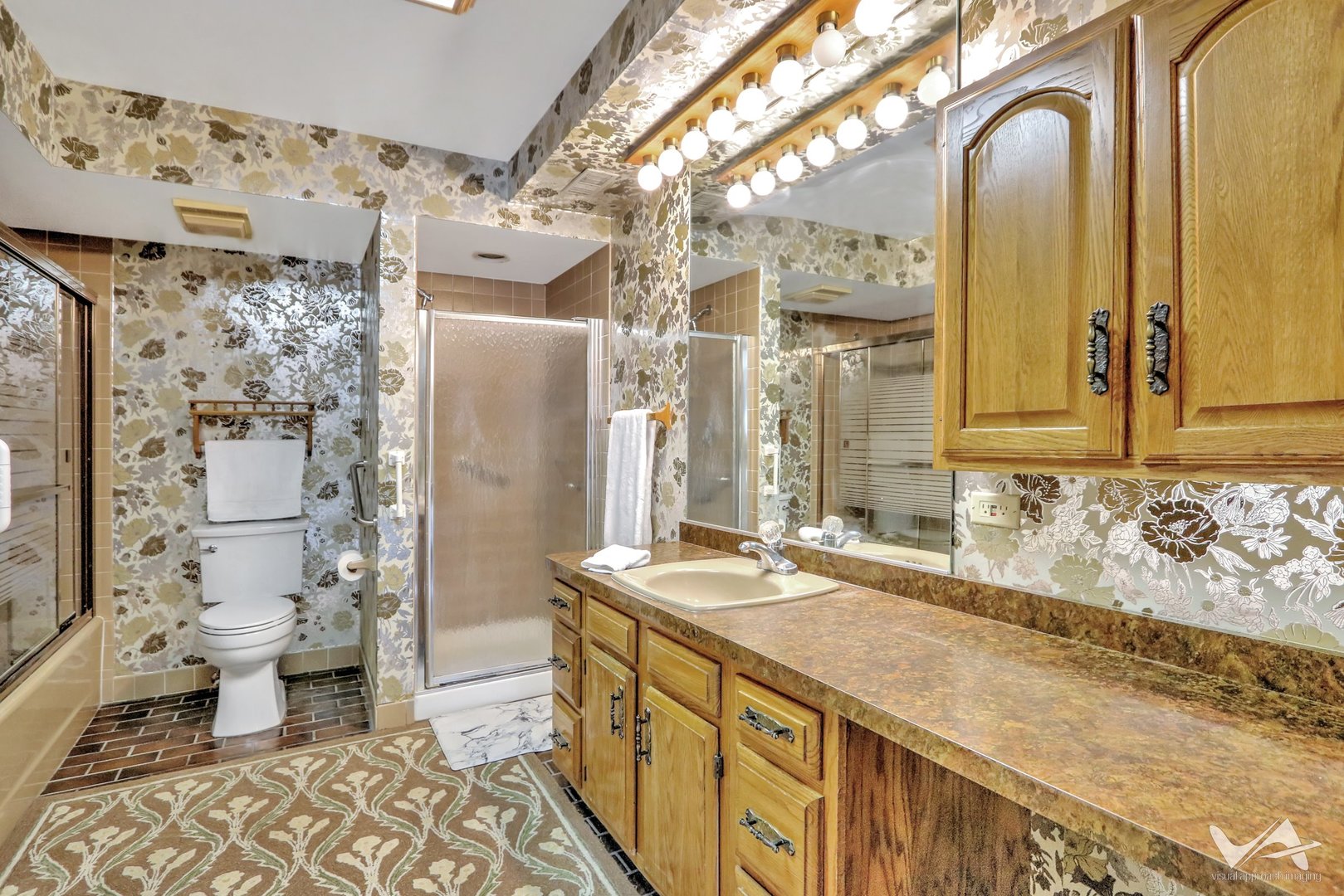 467 Hiawatha Trail, Unit 201 Wood Dale, IL 60191 - Photo 20 of 35 a bathroom with a granite countertop double vanity sink mirror and toilet