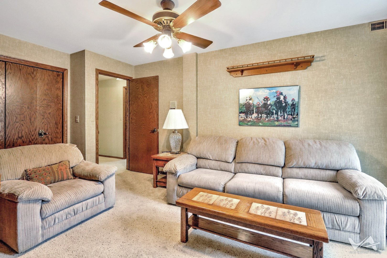 467 Hiawatha Trail, Unit 201 Wood Dale, IL 60191 - Photo 23 of 35 a living room with furniture and a painting