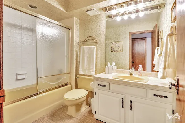 a glass door with shower