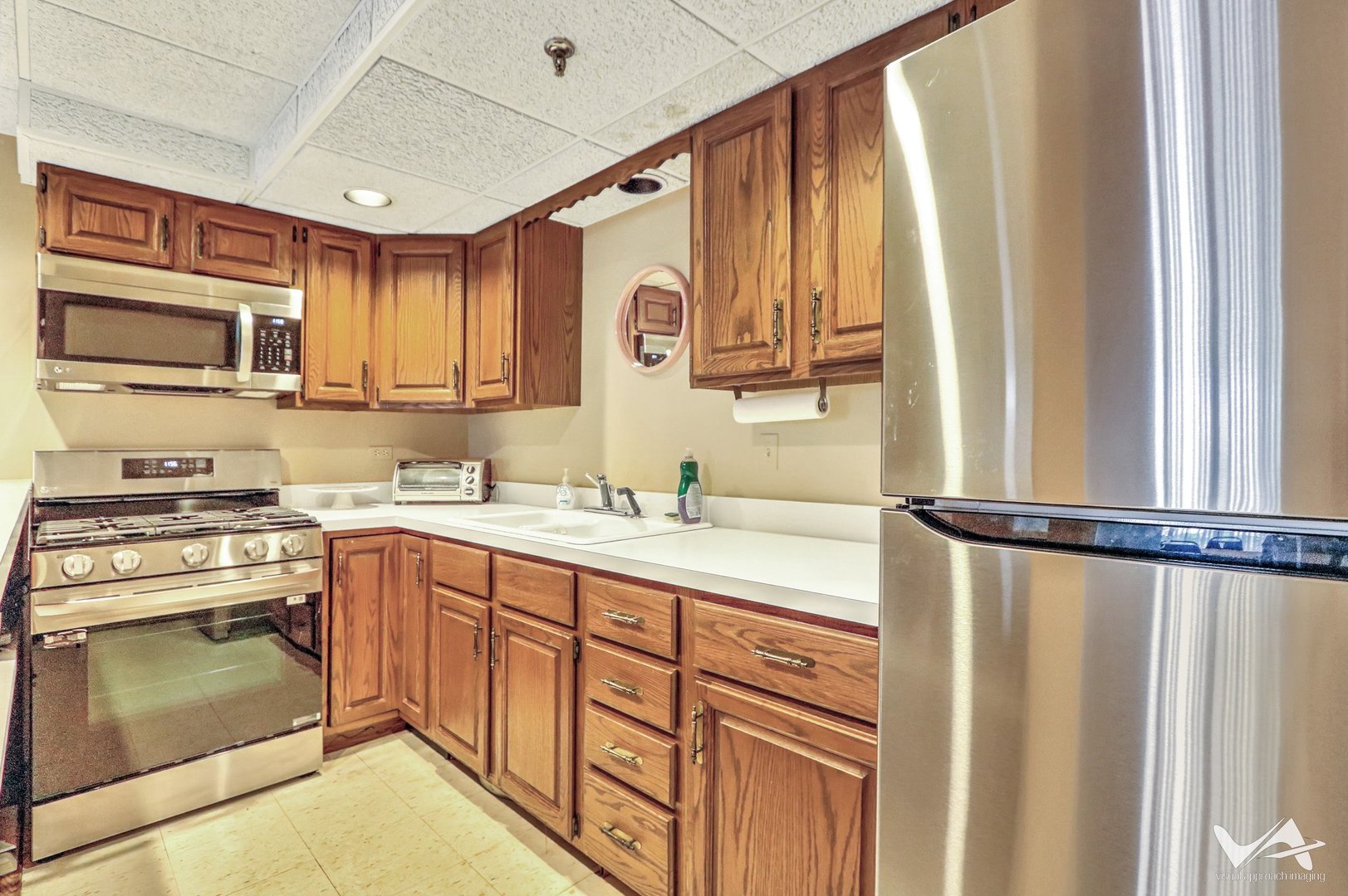 467 Hiawatha Trail, Unit 201 Wood Dale, IL 60191 - Photo 30 of 35 a kitchen with stainless steel appliances granite countertop a stove sink and cabinets