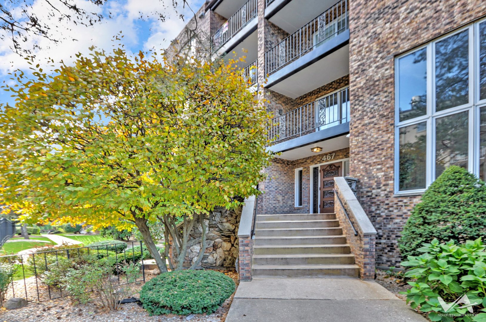 467 Hiawatha Trail, Unit 201 Wood Dale, IL 60191 - Photo 3 of 35 a view of a house with entryway and plants