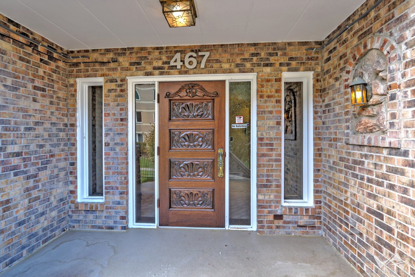 467 Hiawatha Trail, Unit 201 Wood Dale, IL 60191 - Photo 5 of 35 a front view of a building with an entrance door