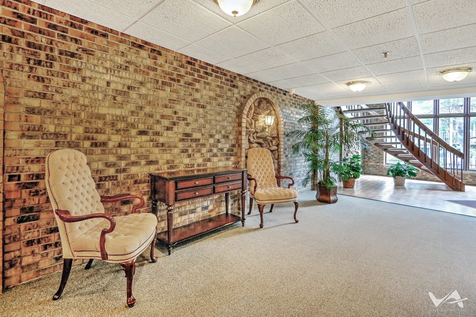 467 Hiawatha Trail, Unit 201 Wood Dale, IL 60191 - Photo 7 of 35 a living room with furniture and a floor to ceiling window