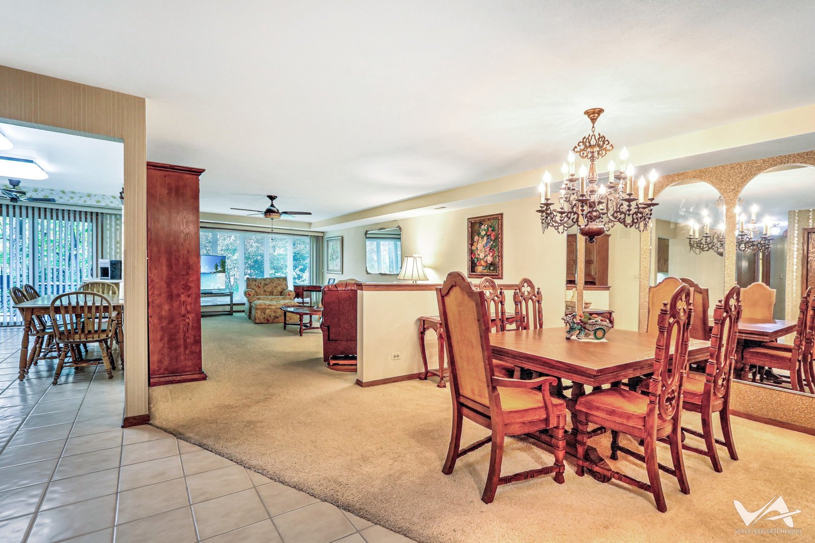 467 Hiawatha Trail, Unit 201 Wood Dale, IL 60191 - Photo 10 of 35 a dining room with furniture a chandelier and a rug