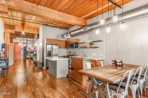 a kitchen with a table and chairs in it