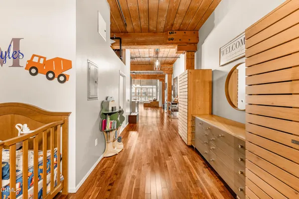a view of a entryway door with wooden floor