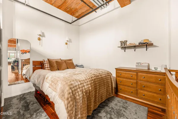 a bedroom with a bed and with closet