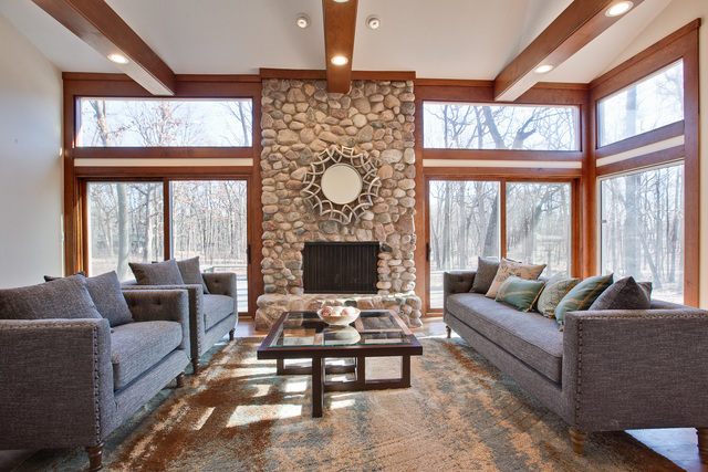 721 Rockefeller Road Lake Forest, IL 60045 - Photo 11 of 25 a living room with furniture a flat screen tv and a large window