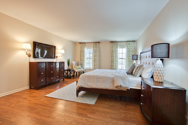 721 Rockefeller Road Lake Forest, IL 60045 - Photo 17 of 25 a bed room with a bed window and a television