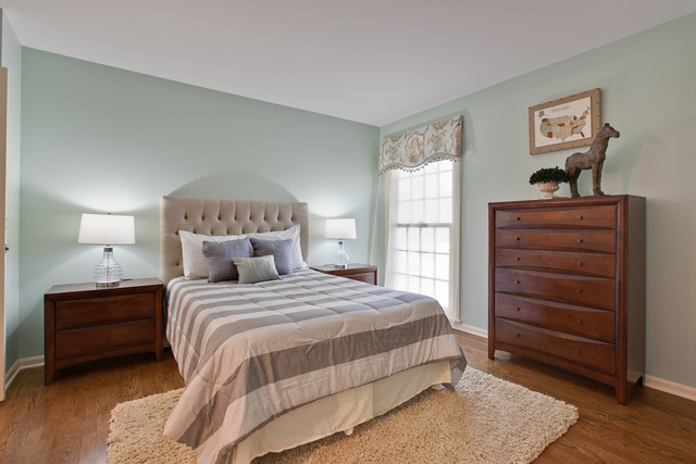 721 Rockefeller Road Lake Forest, IL 60045 - Photo 19 of 25 a bedroom with a bed and a night stand