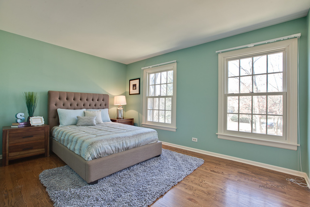 721 Rockefeller Road Lake Forest, IL 60045 - Photo 20 of 25 a bedroom with a large bed and a window