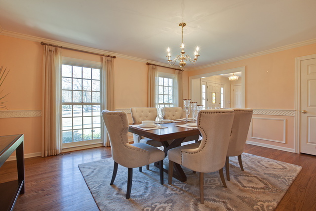 721 Rockefeller Road Lake Forest, IL 60045 - Photo 5 of 25 a view of a dining room with furniture window and wooden floor