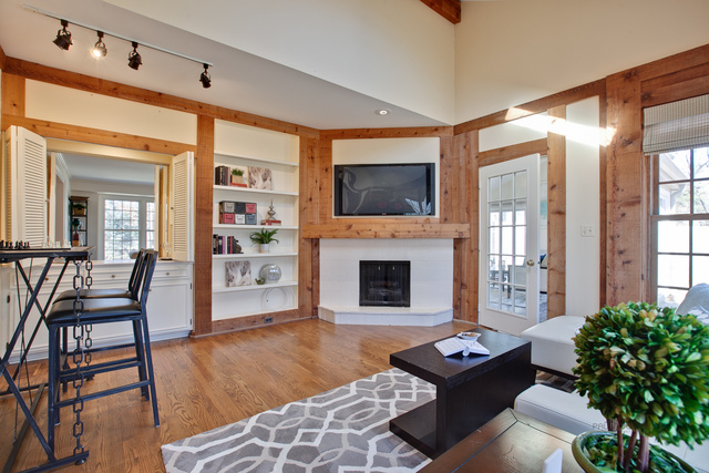 721 Rockefeller Road Lake Forest, IL 60045 - Photo 8 of 25 a living room with furniture a flat screen tv and a fireplace