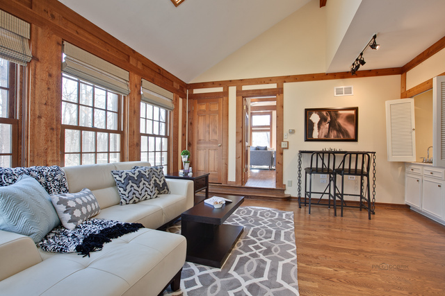721 Rockefeller Road Lake Forest, IL 60045 - Photo 9 of 25 a living room with furniture and a window with wooden floor