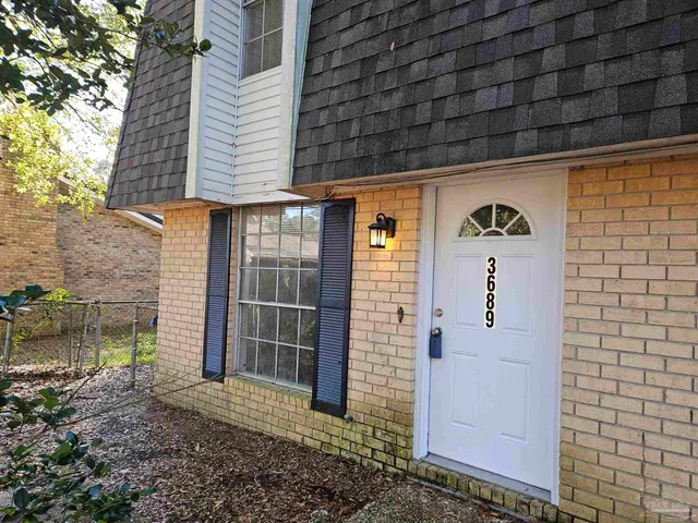 a view of outdoor space and front view of a building