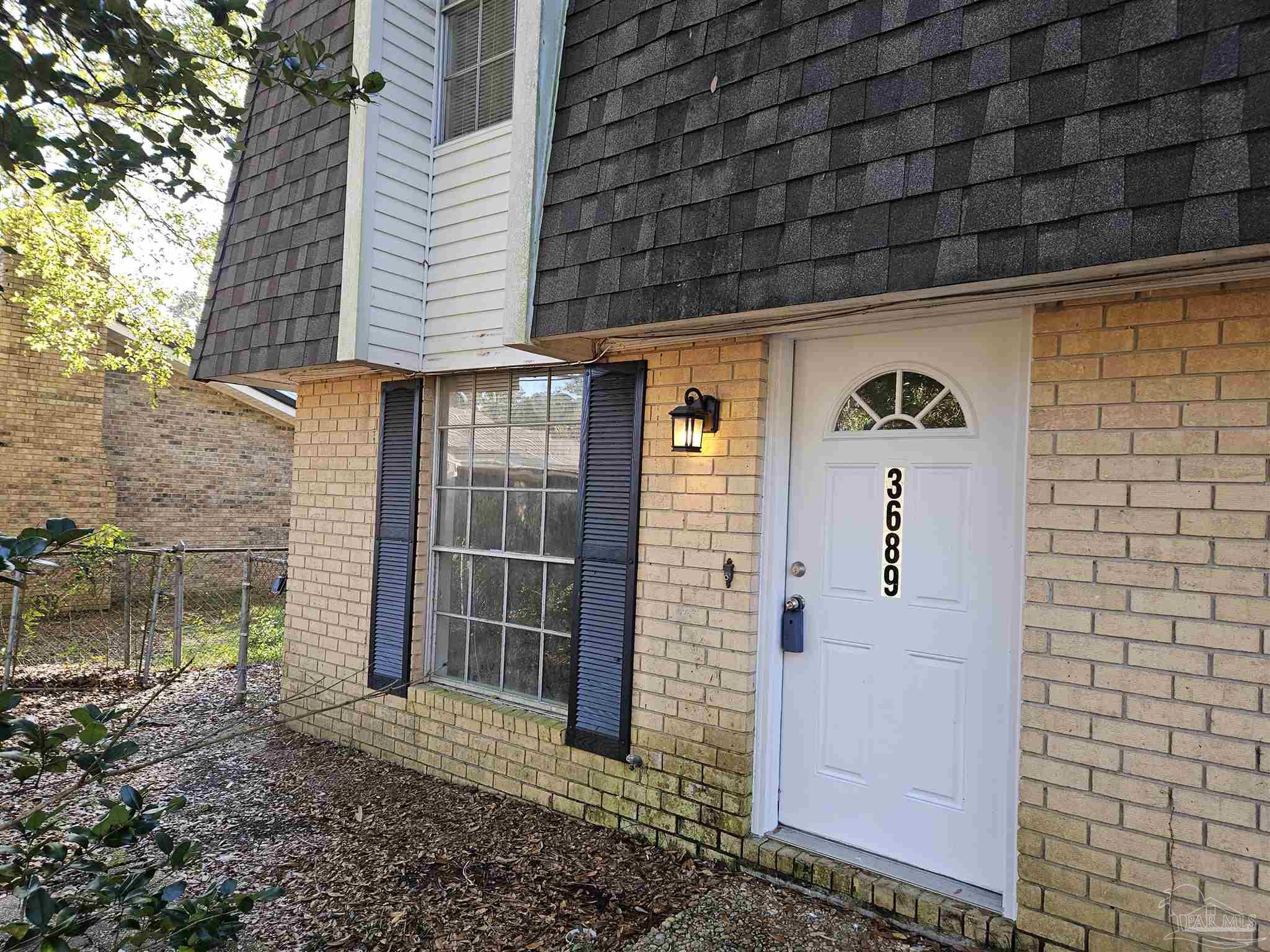 a view of outdoor space and front view of a building