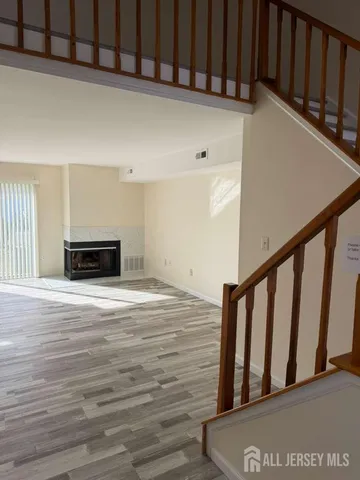 a view of wooden floor and staircase