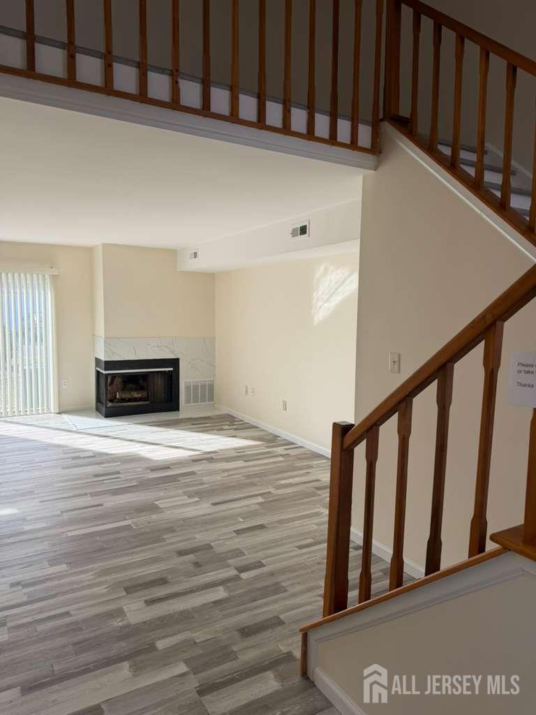 126 Winchester Way Somerset, NJ 08873 - Photo 11 of 33 a view of wooden floor and staircase