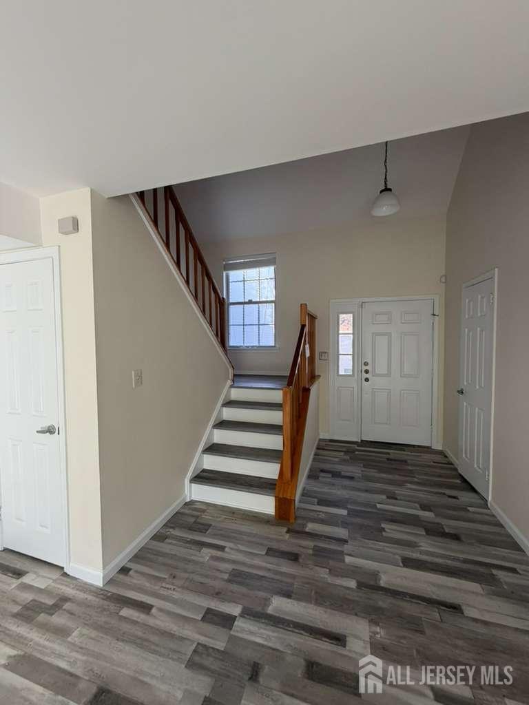 126 Winchester Way Somerset, NJ 08873 - Photo 14 of 33 a view of entryway and hall with wooden floor