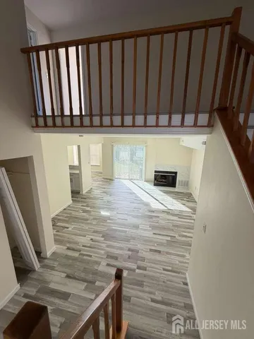 a view of hallway with wooden floor