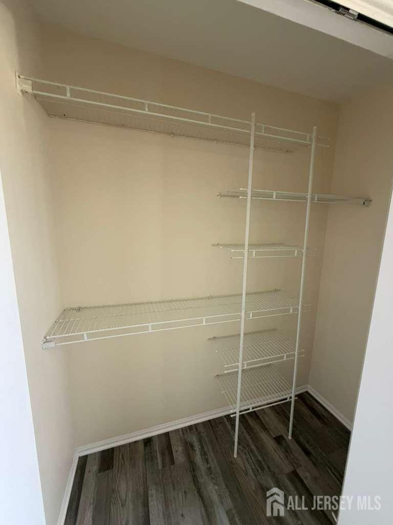 126 Winchester Way Somerset, NJ 08873 - Photo 22 of 33 a view of a room with empty racks