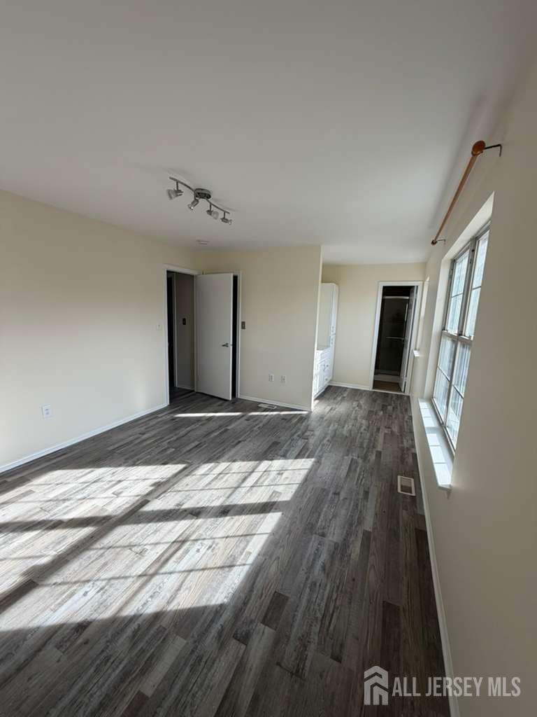 126 Winchester Way Somerset, NJ 08873 - Photo 23 of 33 a view of a livingroom with wooden floor and staircase