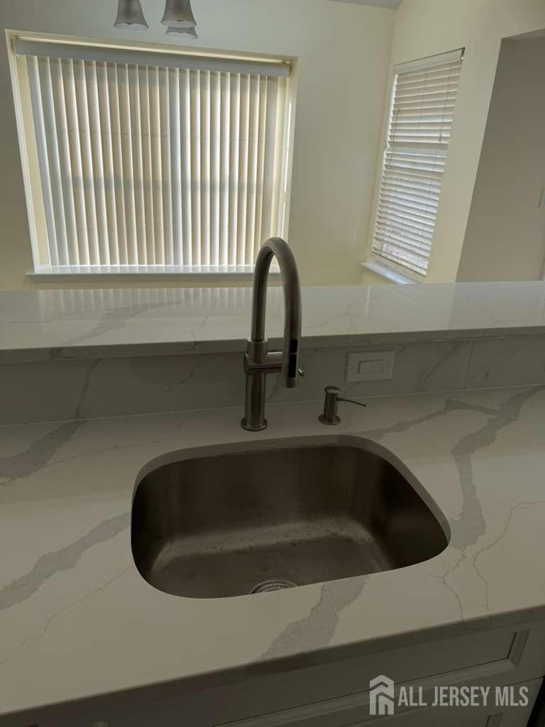 126 Winchester Way Somerset, NJ 08873 - Photo 24 of 33 a close view of a sink and a microwave