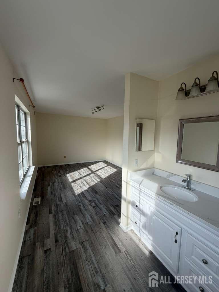 126 Winchester Way Somerset, NJ 08873 - Photo 27 of 33 a bathroom with a sink and a mirror