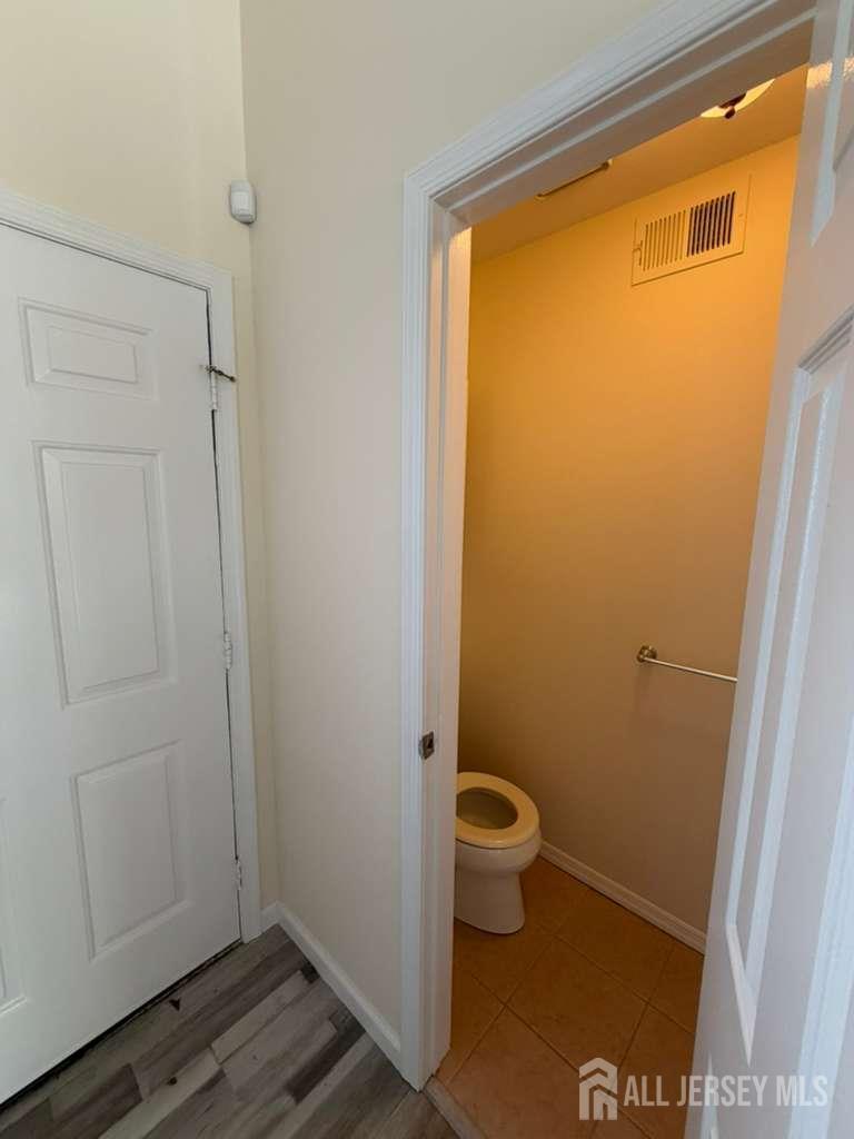 126 Winchester Way Somerset, NJ 08873 - Photo 30 of 33 a bathroom with a sink and a toilet