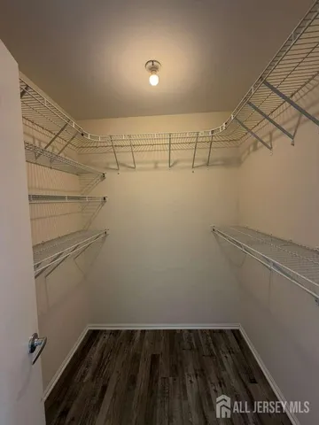 a bathroom with a sink and mirror with toilet