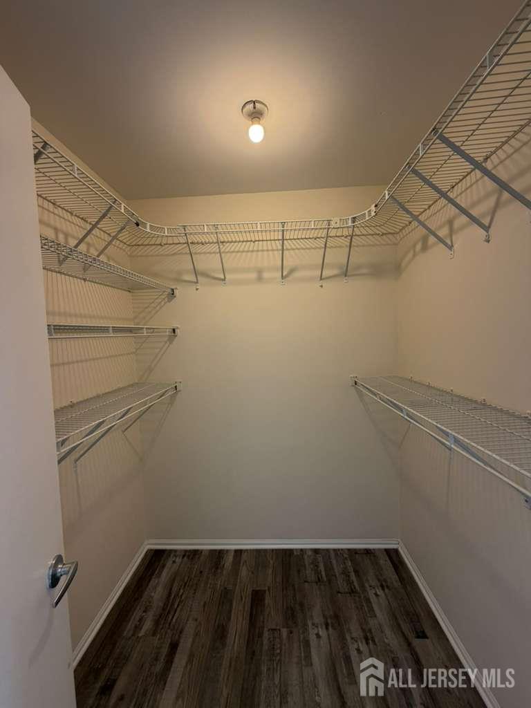 126 Winchester Way Somerset, NJ 08873 - Photo 31 of 33 a view of a room with racks on the wall