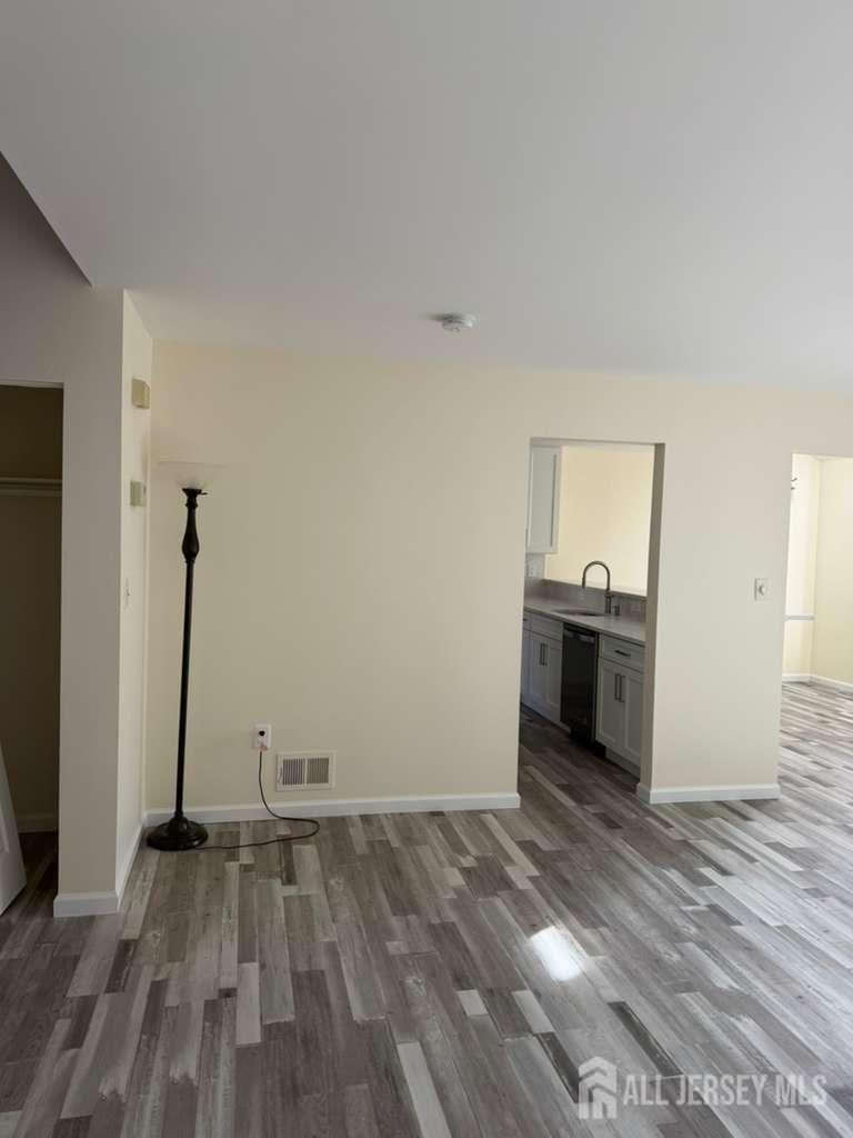 126 Winchester Way Somerset, NJ 08873 - Photo 4 of 33 a view of empty room with wooden floor