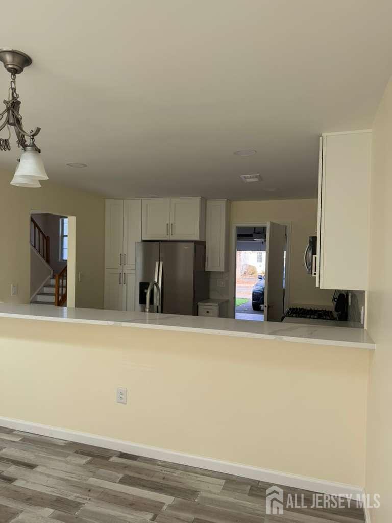 126 Winchester Way Somerset, NJ 08873 - Photo 8 of 33 a view of a kitchen with a sink and a refrigerator