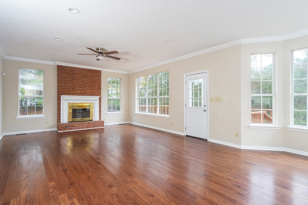 136 Gates Road Lizella, GA 31052 - Photo 8 of 29 a view of an empty room with wooden floor and a window