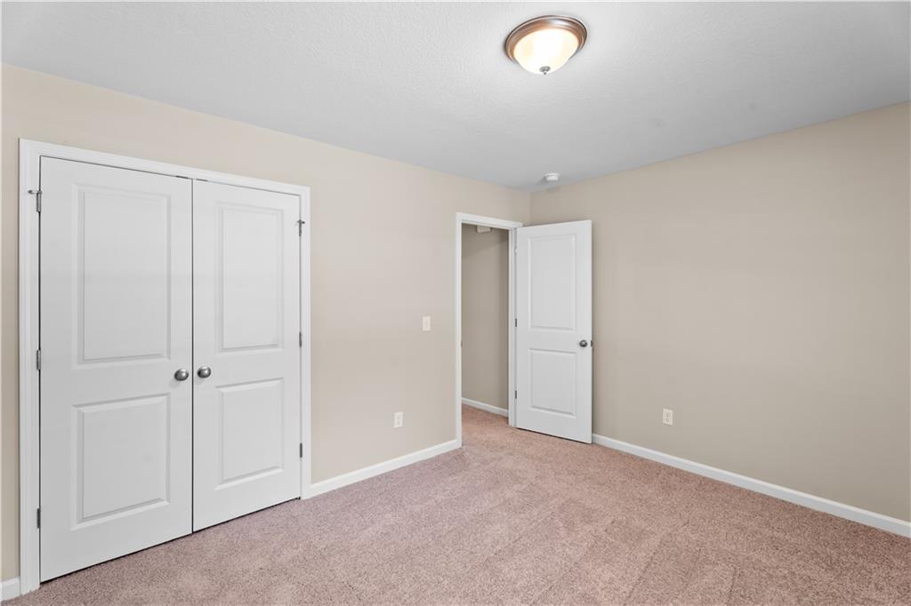 31 Whiterock Road Phenix City, AL 36869 - Photo 26 of 36 Unfurnished bedroom with carpet floors and a closet