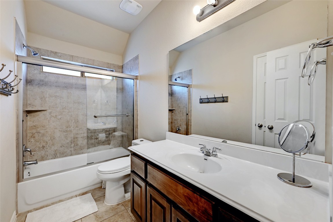 2812 St Paul Rivera Round Rock, TX 78665 - Photo 17 of 28 a bathroom with a granite countertop sink a toilet and shower