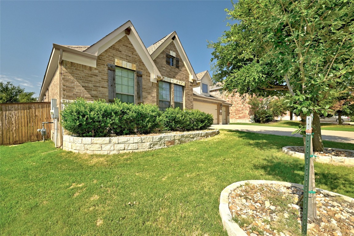 2812 St Paul Rivera Round Rock, TX 78665 - Photo 2 of 28 a front view of a house with garden