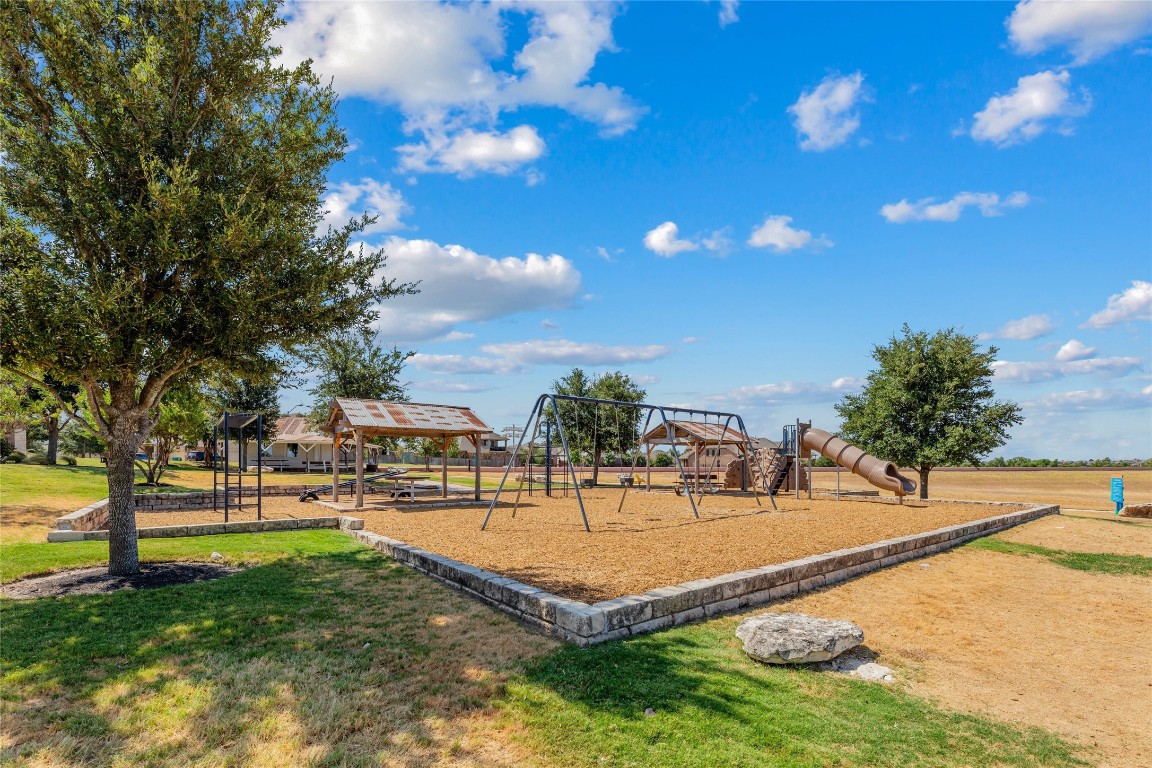 2812 St Paul Rivera Round Rock, TX 78665 - Photo 26 of 28 a swimming pool with outdoor seating and yard