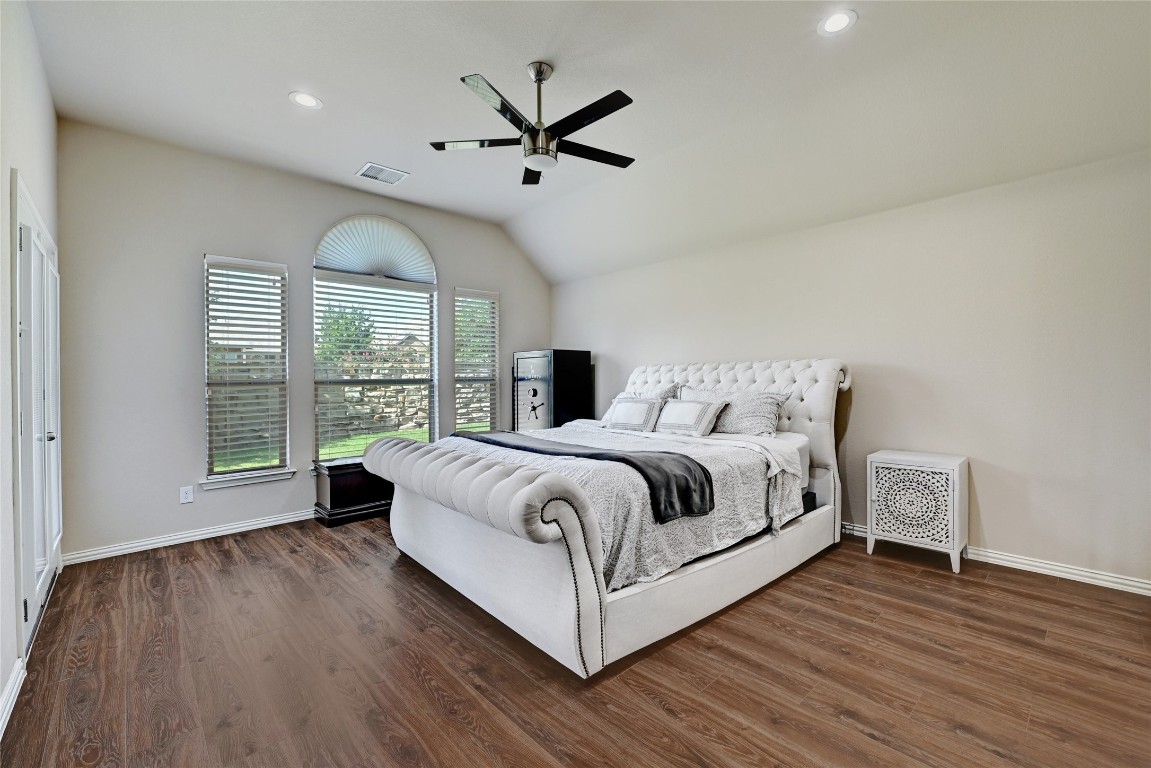 2812 St Paul Rivera Round Rock, TX 78665 - Photo 9 of 28 a bedroom with a large bed and a large window