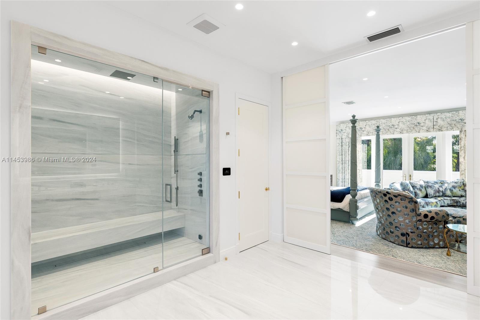 6350 Allison Road Miami Beach, FL 33141 - Photo 22 of 57 a bathroom with a tub shower and sink