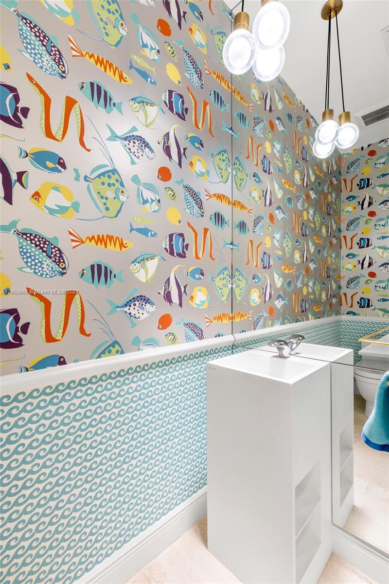 6350 Allison Road Miami Beach, FL 33141 - Photo 36 of 57 a utility room with a sink a washer and dryer