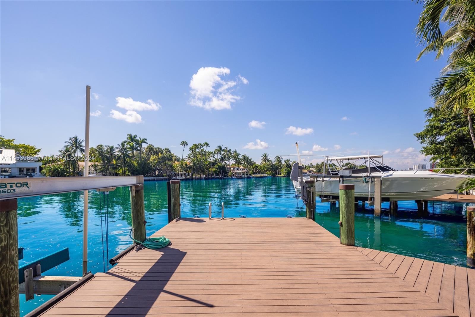 6350 Allison Road Miami Beach, FL 33141 - Photo 44 of 57 a view of a balcony with wooden floor and lake view
