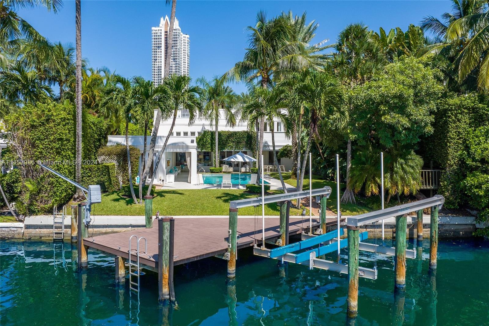 6350 Allison Road Miami Beach, FL 33141 - Photo 47 of 57 a view of a house with swimming pool and sitting area