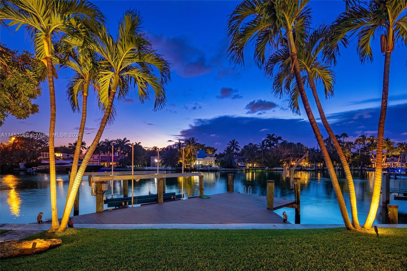 6350 Allison Road Miami Beach, FL 33141 - Photo 50 of 57 a view of a yard with plants and a bench