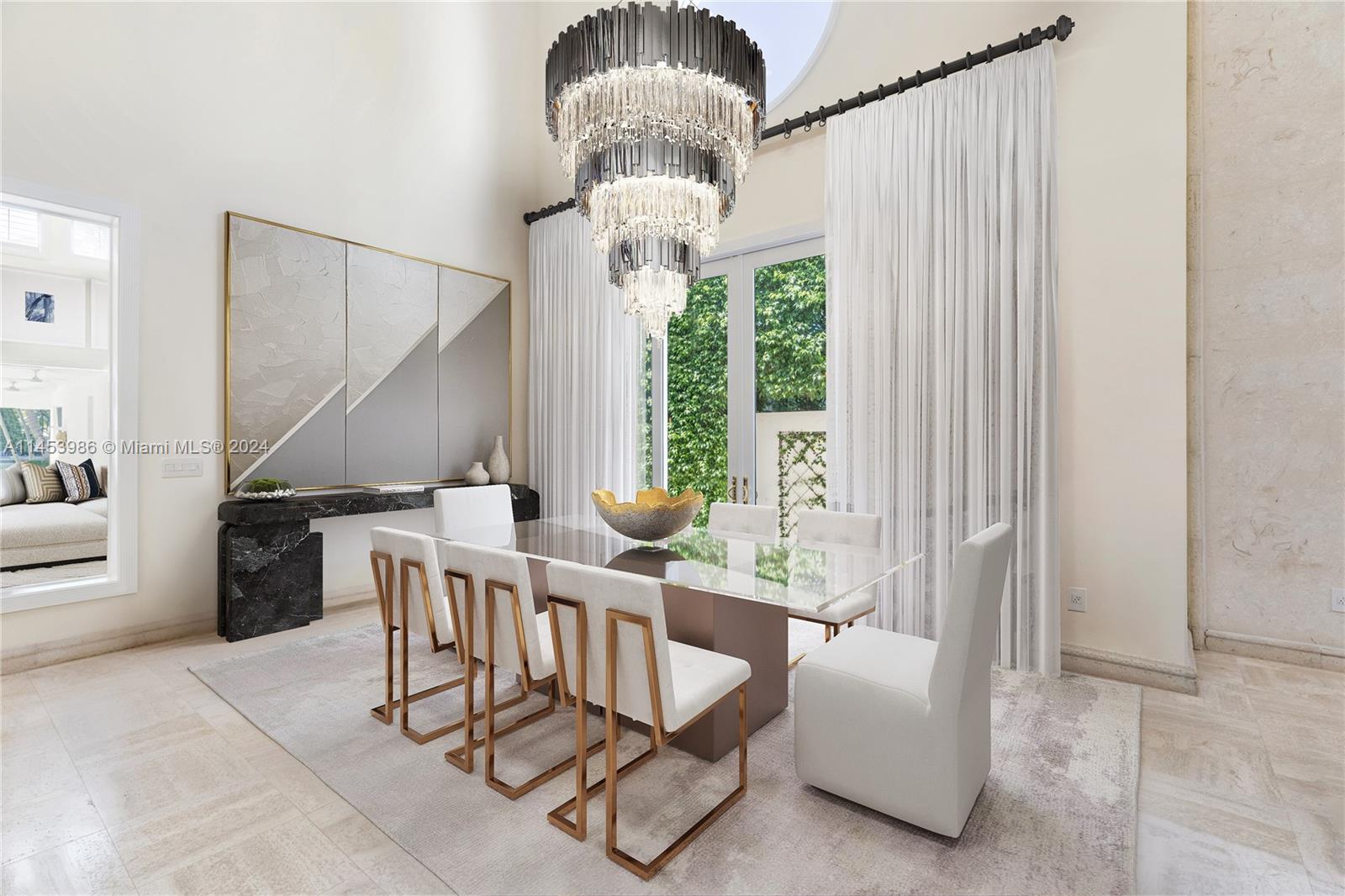 6350 Allison Road Miami Beach, FL 33141 - Photo 9 of 57 a dining room with furniture and a large window