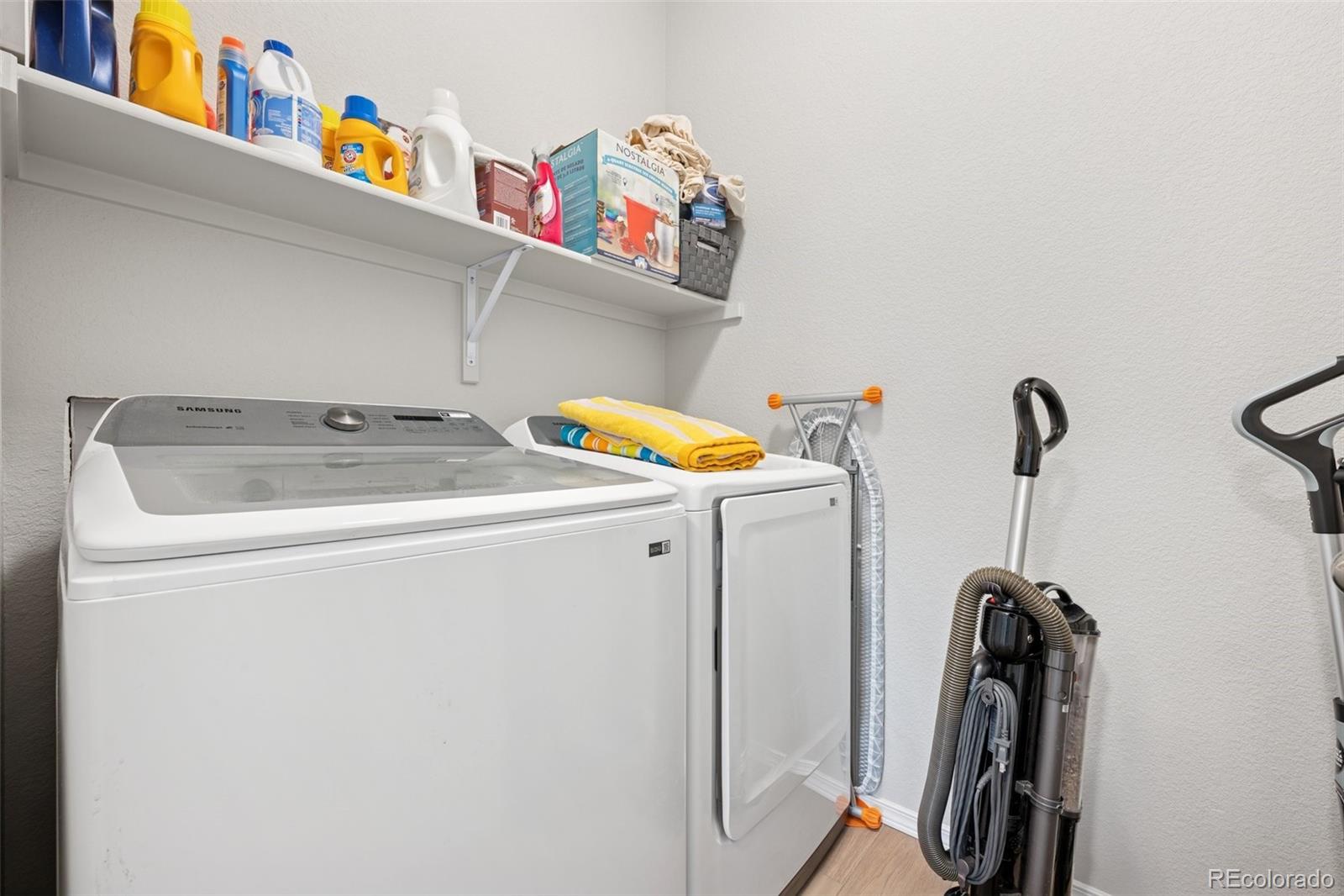 12846 Granite Ridge Drive Peyton, CO 80831 - Photo 21 of 32 a utility room with dryer and washer