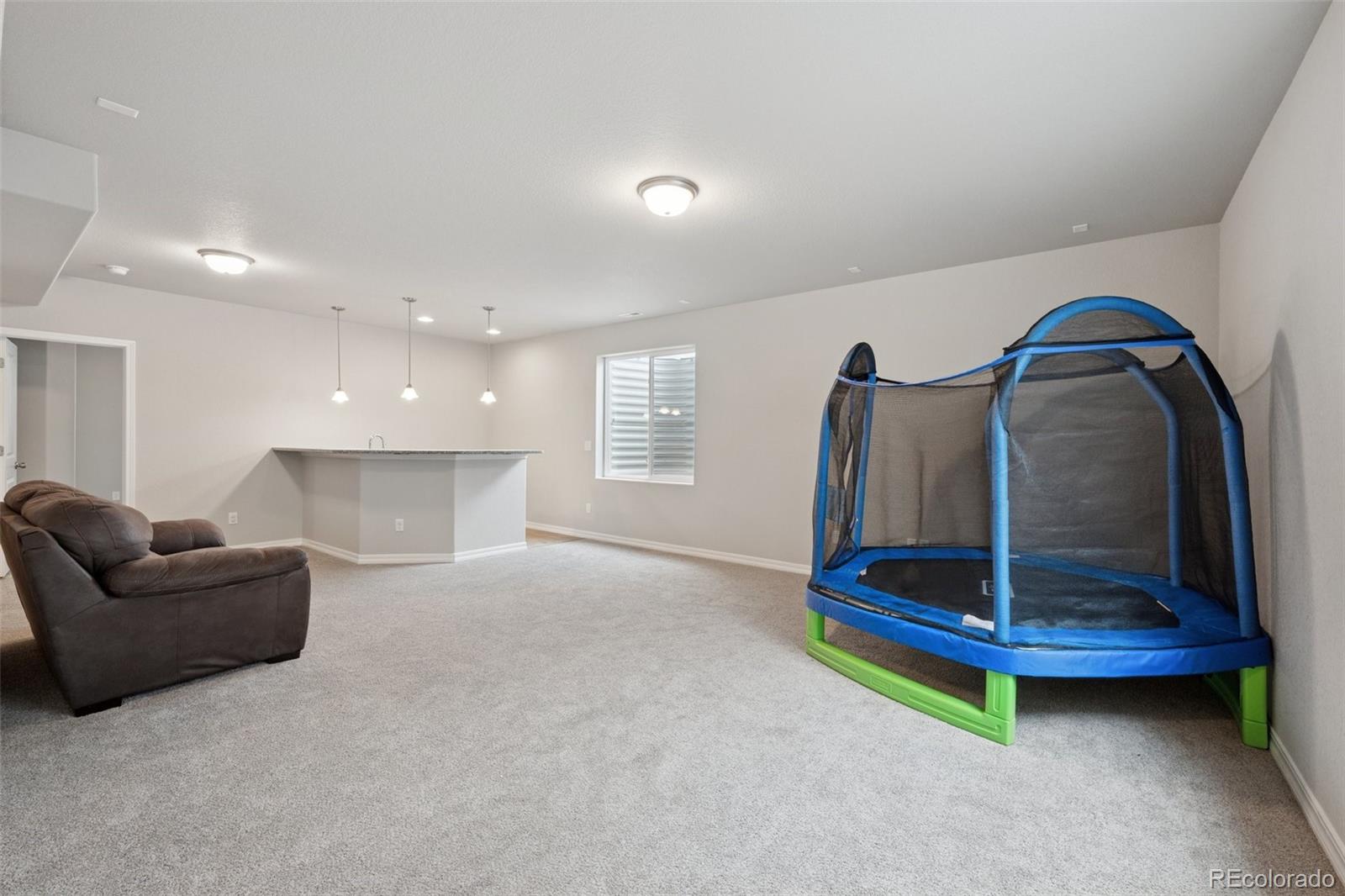 12846 Granite Ridge Drive Peyton, CO 80831 - Photo 23 of 32 a living room with furniture